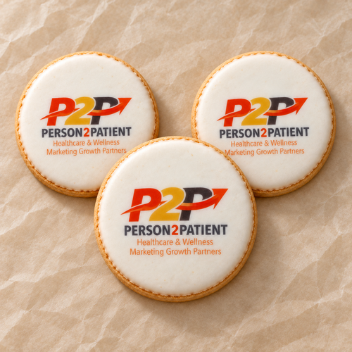 Three Person2Patient logo cookies arranged on cream parchment.
