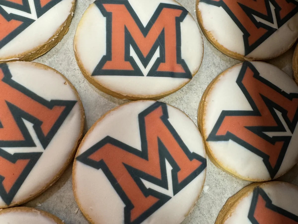 Round cookies printed with a University of Maryland-style letter design