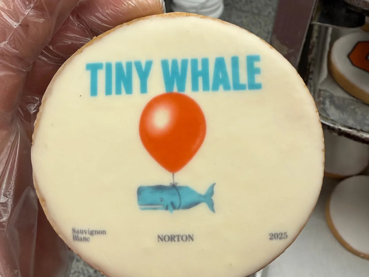 A colorful business logo printed on a round custom cookie